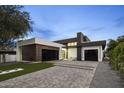 Stunning contemporary home featuring clean lines, a modern design, and a spacious driveway at 7009 E Pasadena Ave, Paradise Valley, AZ 85253