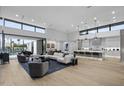 Open-concept living space boasts high ceilings, large windows, and seamless transition to outdoor area at 7009 E Pasadena Ave, Paradise Valley, AZ 85253