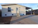 Charming home exterior with a covered porch, fresh concrete and an easy-to-maintain landscaped yard at 7836 E Javelina Ave, Mesa, AZ 85209