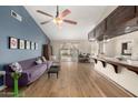 Bright and airy living room features vaulted ceilings, modern furniture, and sliding glass doors to the backyard at 923 E Aire Libre Ave, Phoenix, AZ 85022
