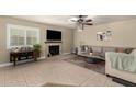 Cozy living room with fireplace, comfortable seating, and neutral color palette, perfect for relaxing at 923 E Aire Libre Ave, Phoenix, AZ 85022