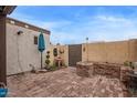 Private backyard features brick flooring, custom planter and manicured landscaping at 1010 E Redfield Rd, Tempe, AZ 85283