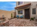 Inviting front patio with brick flooring, seating area, and stylish decor at 1010 E Redfield Rd, Tempe, AZ 85283