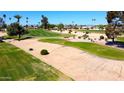 Scenic view of the lush green golf course, showcasing a well-maintained landscape at 10416 W Prairie Hills Cir, Sun City, AZ 85351