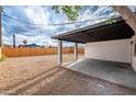 Covered back patio featuring a neutral color scheme overlooking a spacious gravel yard at 10947 W Mohave St, Avondale, AZ 85323