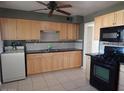 Kitchen with stainless steel appliances and a ceiling fan at 11410 N 105Th Ave, Sun City, AZ 85351