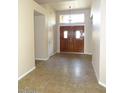 Bright entryway featuring tile floors and a solid wood double door at 14648 S 25Th St, Phoenix, AZ 85048