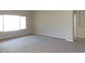 Neutral living room with plush carpet and lots of natural light at 14648 S 25Th St, Phoenix, AZ 85048