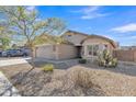 Side view of home featuring desert landscaping, a driveway, and low-maintenance curb appeal at 3013 W Pollack St, Phoenix, AZ 85041