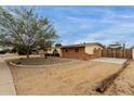 Exterior view of a home with a low-maintenance gravel front yard at 3212 W Paradise Dr, Phoenix, AZ 85029