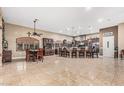 Open concept kitchen featuring a large island, stainless steel appliances, and barstool seating at 3718 N Briere Ct, Buckeye, AZ 85396