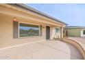 Welcoming front porch features neutral walls, a gray trimmed window, and ample outdoor space at 4126 E Carmel Ave, Mesa, AZ 85206