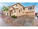 Two-story home with attached garage and extended driveway provides ample parking space at 4129 W Park St, Phoenix, AZ 85041