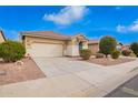 Charming single-story home featuring a two-car garage and low maintenance desert landscaping at 41304 W Rio Bravo Dr, Maricopa, AZ 85138