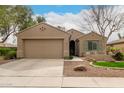 Charming single-story home with a well-maintained yard and a two-car garage at 4266 S Winter Ln, Gilbert, AZ 85297