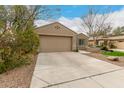 Charming single-story home with a well-maintained yard and a two-car garage at 4266 S Winter Ln, Gilbert, AZ 85297