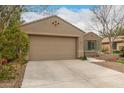 Charming single-story home with a well-maintained yard and a two-car garage at 4266 S Winter Ln, Gilbert, AZ 85297