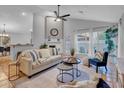 Bright, spacious living room featuring vaulted ceilings, neutral paint, tile floors and stylish furnishings at 430 E Utopia Rd, Phoenix, AZ 85024