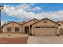 Charming single-story home featuring a well-manicured front yard and attached two-car garage at 4537 E Towne Ln, Gilbert, AZ 85234