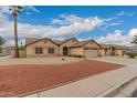 Charming single-story home featuring a well-manicured front yard and attached two-car garage at 4537 E Towne Ln, Gilbert, AZ 85234