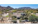 Beautiful community with views of mountains surrounding lush landscaping and elegant homes at 5858 E Caballo Dr, Paradise Valley, AZ 85253