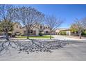 Attractive home with a well-kept lawn, appealing stone accents, and a spacious three-car garage at 6192 S Claiborne Ave, Gilbert, AZ 85298