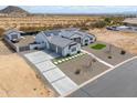 Aerial view of modern single-story home featuring clean lines, solar panels and desert landscape at 6645 N Paint Ln, Casa Grande, AZ 85194