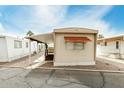 Charming mobile home featuring a covered porch and neutral exterior at 730 S Country Club Dr # 5, Mesa, AZ 85210