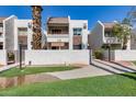 South Scottsdale condominium building with stucco exterior, tiled roof, and desert landscaping at 7350 N Via Paseo Del Sur -- # N104, Scottsdale, AZ 85258