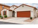 Charming single-story home with a red-tile roof, desert landscaping, and a two-car garage at 7421 W Montgomery Rd, Peoria, AZ 85383