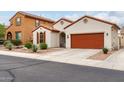 Charming single-story home with a red-tile roof, desert landscaping, and a two-car garage at 7421 W Montgomery Rd, Peoria, AZ 85383