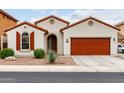 Charming single-story home with a red-tile roof, desert landscaping, and a two-car garage at 7421 W Montgomery Rd, Peoria, AZ 85383