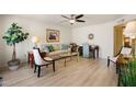 Bright living room featuring neutral tones, stylish furniture, and wood-look flooring at 7755 E Laguna Azul Ave # 184, Mesa, AZ 85209