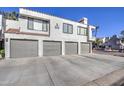 Multi-Gathering home featuring four garage doors and a well-maintained exterior at 10115 E Mountain View Rd # 1005, Scottsdale, AZ 85258