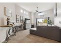 Bright living room with clerestory windows, fireplace, balcony, and unique bicycle wine rack at 11260 N 92Nd St # 2025, Scottsdale, AZ 85260