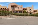 Charming two-story stucco home with a red tile roof and desert landscaping at 13227 N Mimosa Dr # 107, Fountain Hills, AZ 85268