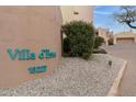 The Villa d'Este community sign and address with desert landscaping at 13227 N Mimosa Dr # 107, Fountain Hills, AZ 85268