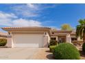 Charming single-story home featuring a two-car garage and well-manicured landscaping at 13312 W Edgemont Ave, Goodyear, AZ 85395