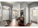 Inviting entryway with views to the dining room, bathroom, and front door at 1622 E Silverbirch Ave, Buckeye, AZ 85326
