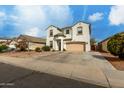Charming stucco two-story home with a two-car garage, desert landscaping, and covered entry at 1622 E Silverbirch Ave, Buckeye, AZ 85326