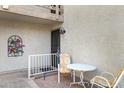 Cozy patio space with chairs and table, perfect for relaxing outdoors at 16624 E Palisades Blvd # 101, Fountain Hills, AZ 85268