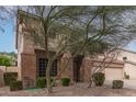 Two-story home with a rock landscape and a well maintained lawn at 1805 E Sagebrush St, Gilbert, AZ 85296