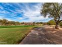 Picturesque view of the golf course with manicured greens and tree-lined fairways at 18610 E Amarado Cir, Rio Verde, AZ 85263