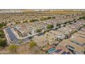 Scenic aerial view of neighborhood featuring houses with tile roofs and some with solar panels at 19013 E Seagull Dr, Queen Creek, AZ 85142