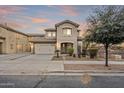 Inviting home with a two-car garage, desert landscaping, and a well-maintained front yard at 19013 E Seagull Dr, Queen Creek, AZ 85142