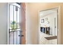 Open foyer with security door and view to the workshop with ample lighting and storage at 20630 N 42Nd Ave, Glendale, AZ 85308