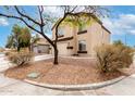 Two-story home featuring a two-car garage, neutral paint and desert landscaping at 23359 W Cocopah St, Buckeye, AZ 85326