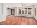 Bright living and dining area boasts hardwood floors, stylish lighting and large windows at 2600 E Springfield Pl # 10, Chandler, AZ 85286