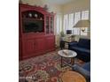 Well-decorated living room featuring an area rug, comfortable seating and shuttered windows at 3131 N Central Ave # 3001, Phoenix, AZ 85012