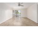 Well-lit living room with sliding glass doors, offering easy access to the outdoors and ample natural light at 3314 N 68Th St # 247, Scottsdale, AZ 85251
